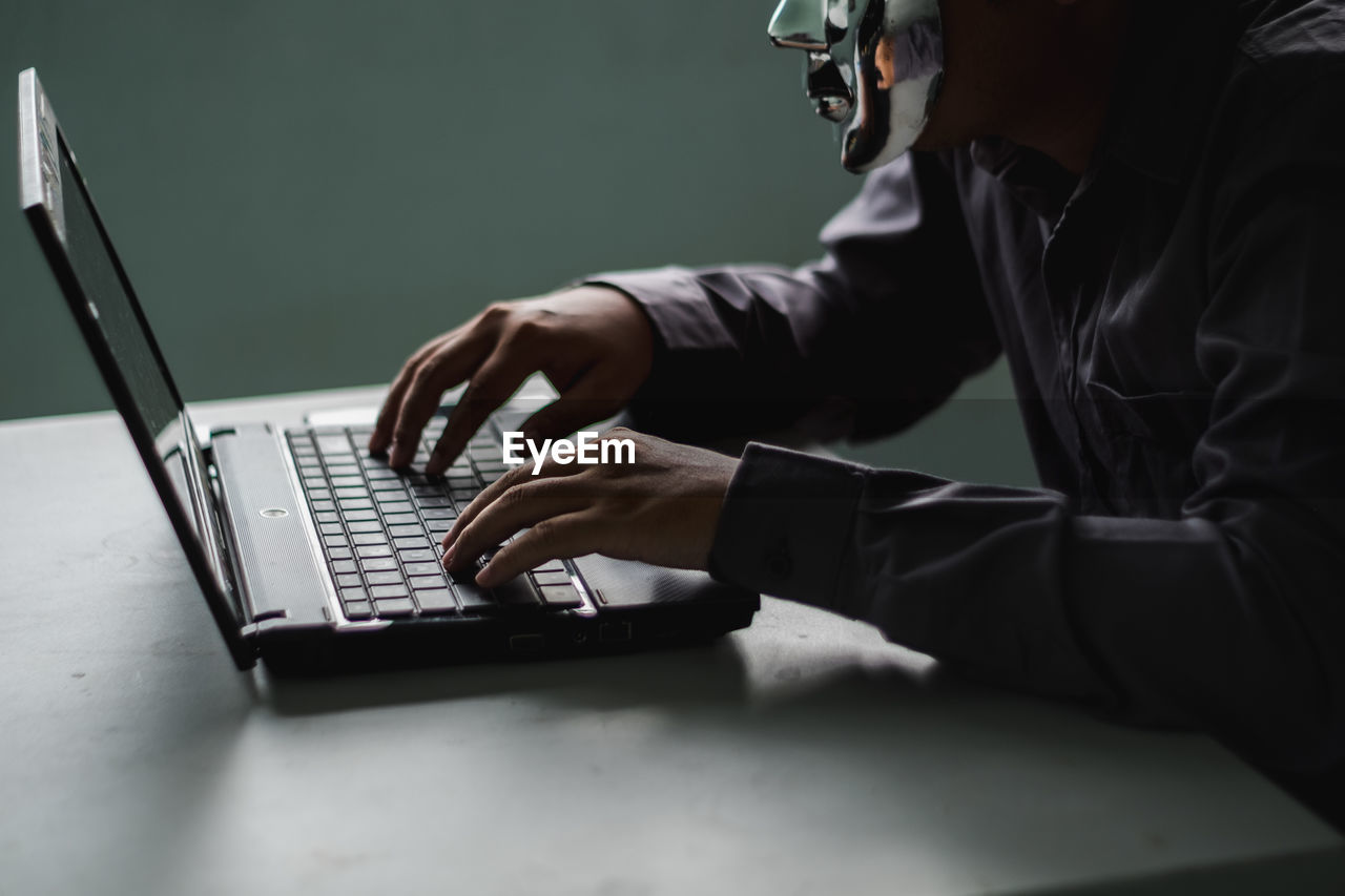 High angle view of man using laptop