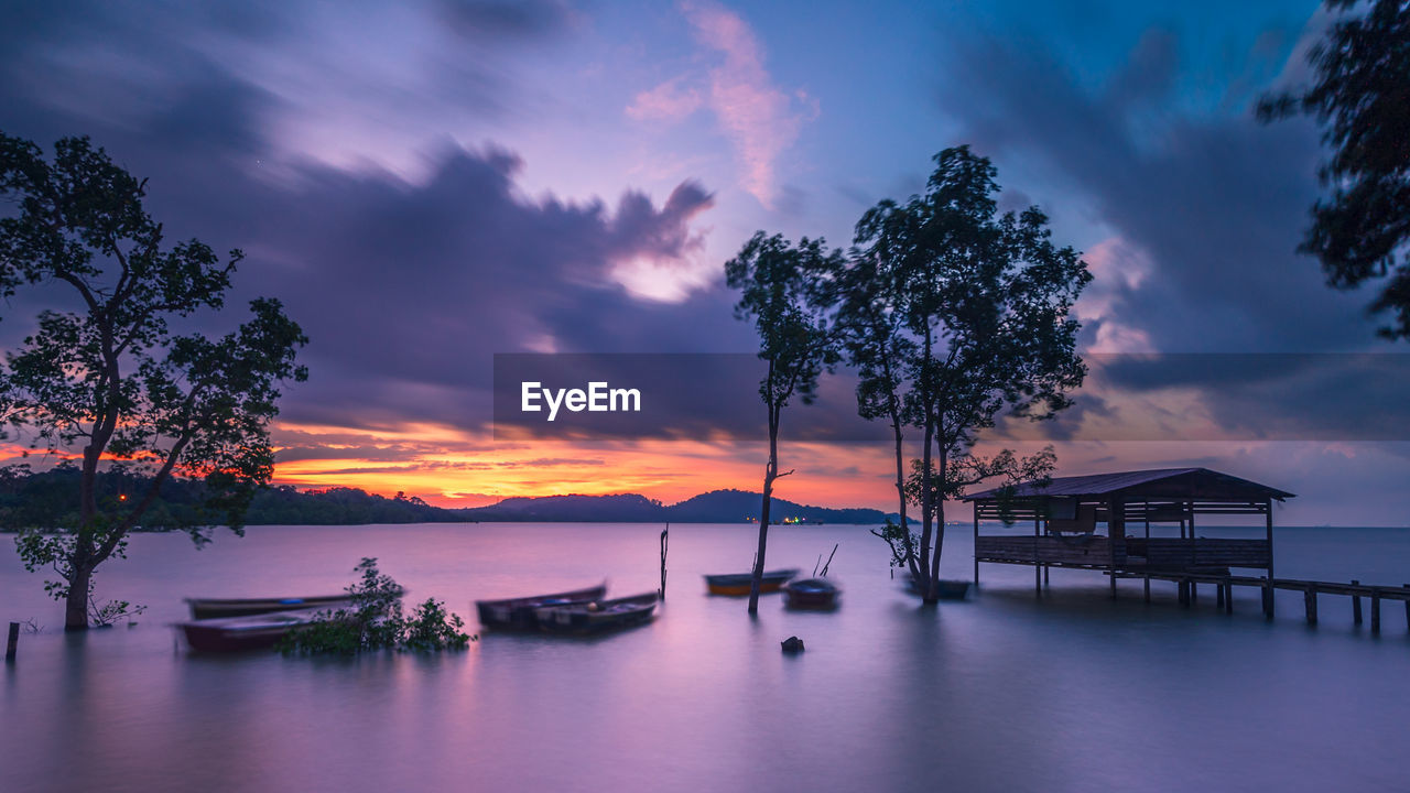 Scenic view of sea against sky at sunset