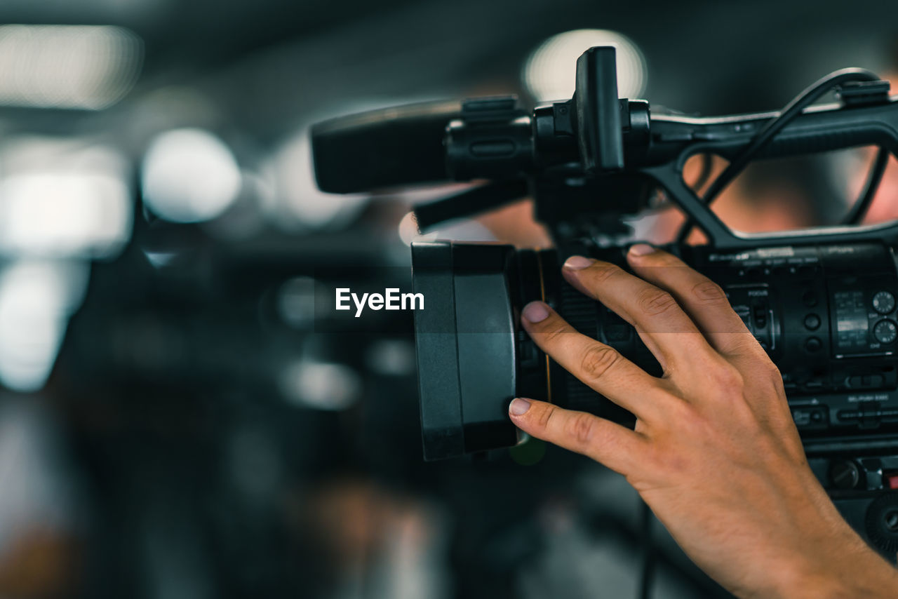 Close-up of hand holding video camera