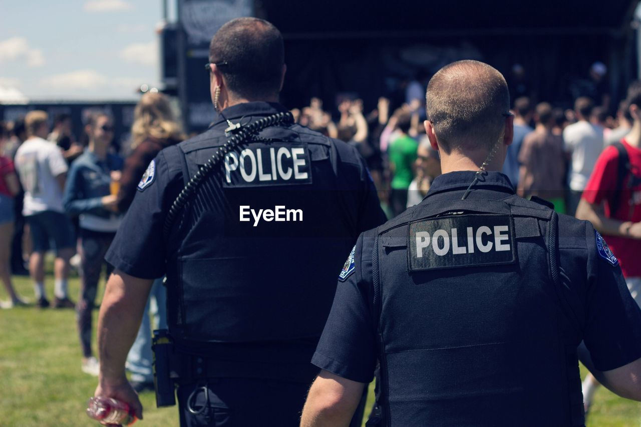 Rear view of police force at park