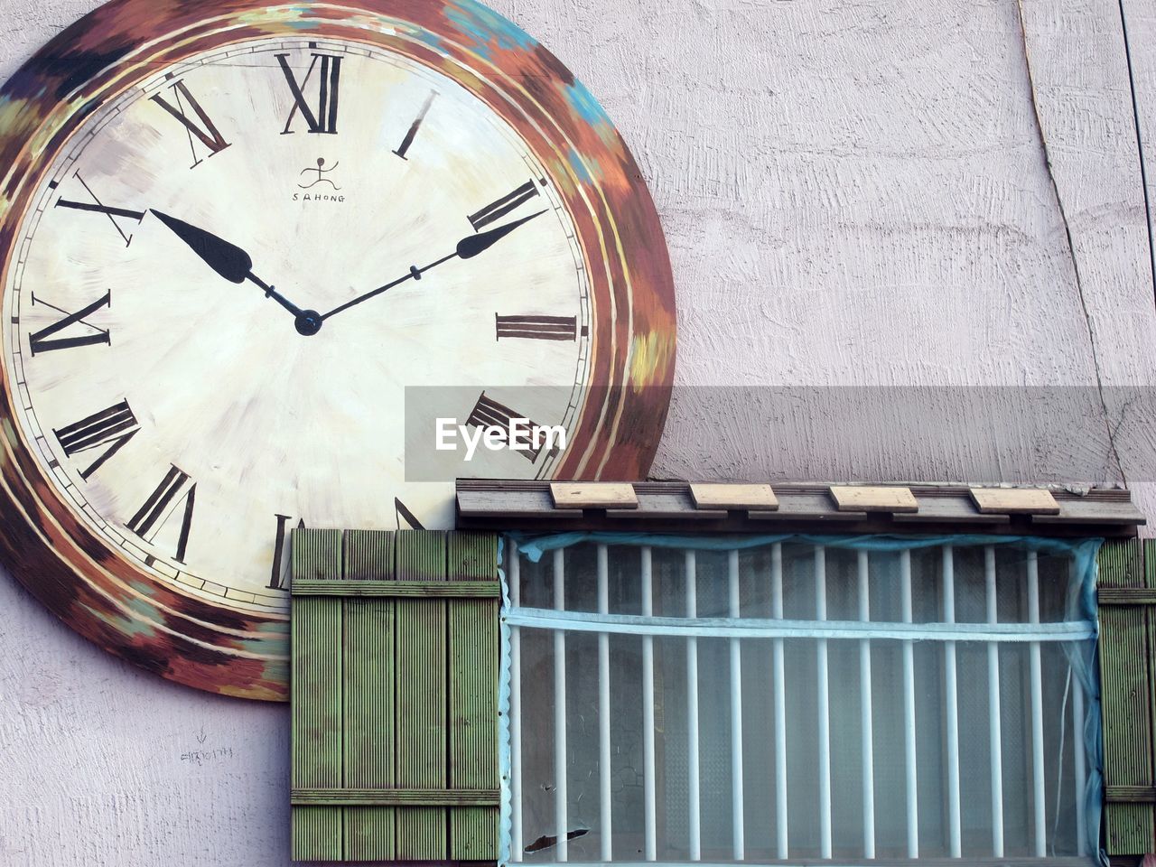 clock, time, wall clock, interior design, wall - building feature, architecture, clock face, no people, built structure, building exterior, furniture, minute hand, roman numeral, instrument of time, day, number, clock hand, geometric shape, wood, building, circle