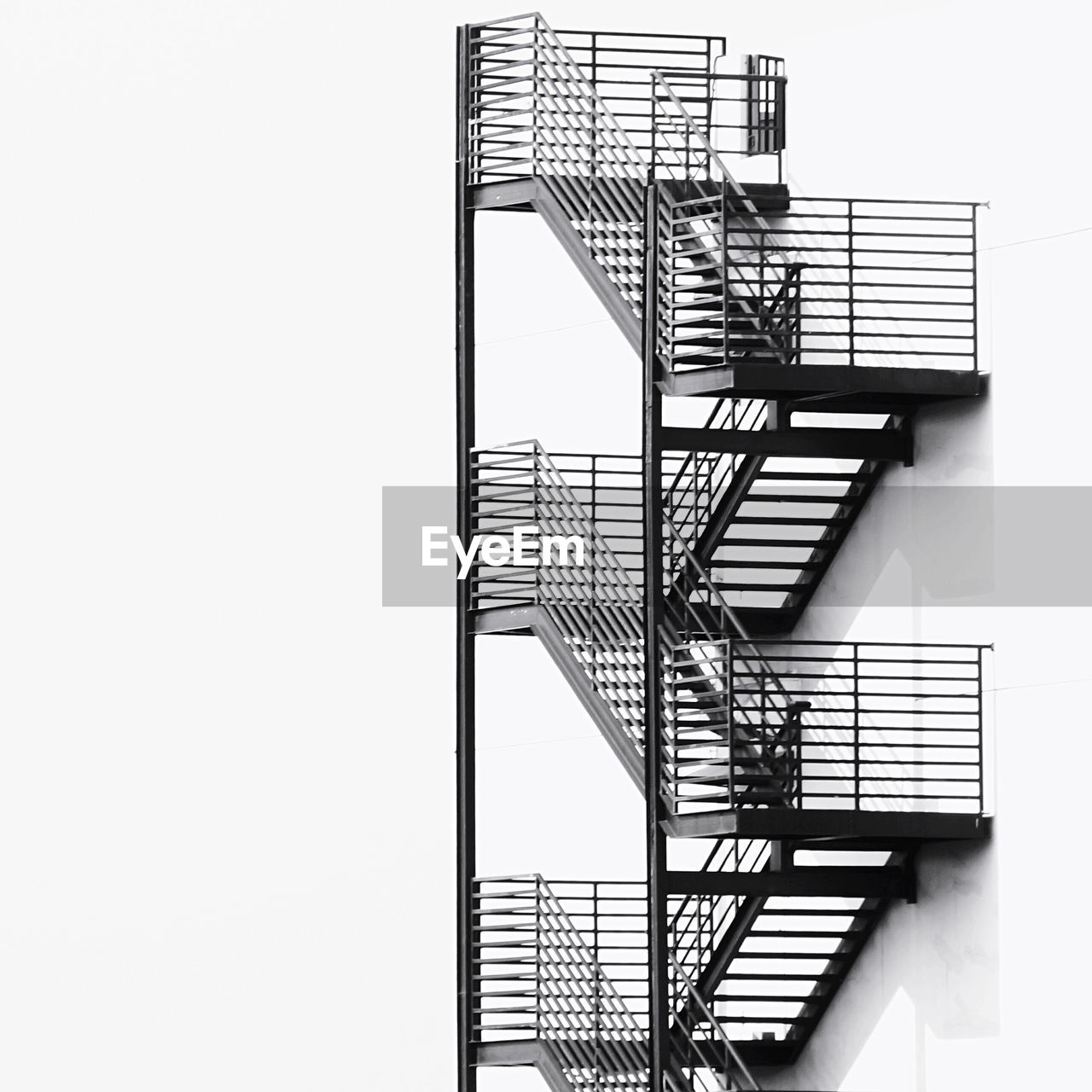 View of metallic fire escape by buildings