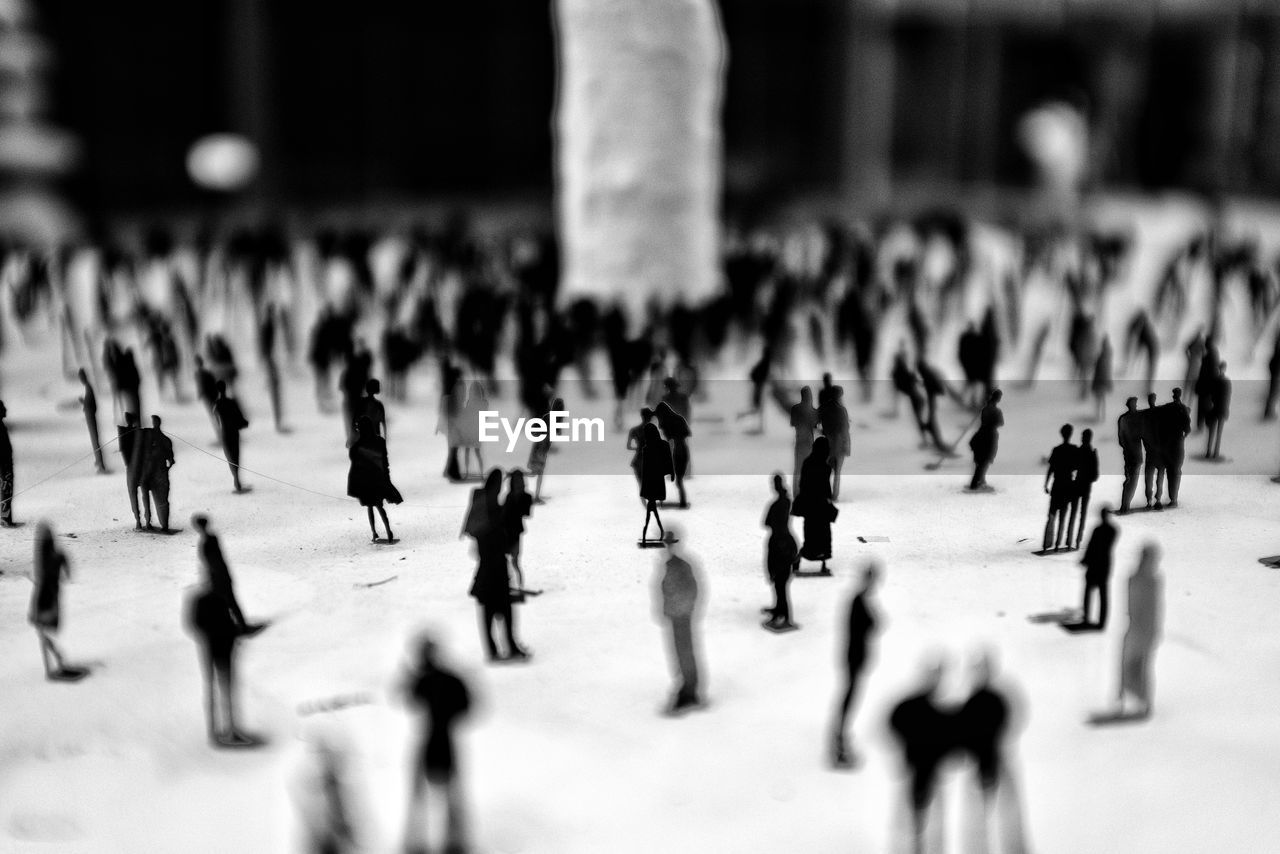 This is a installation art, a group of mini people on the ground to show the flatness of the soul.