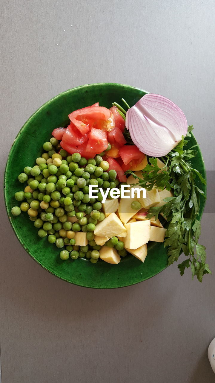 food and drink, food, healthy eating, wellbeing, vegetable, freshness, fruit, produce, indoors, dish, high angle view, no people, green, plate, plant, still life, raw food, directly above, variation, salad, bowl, ingredient, table, meal, snap pea, organic