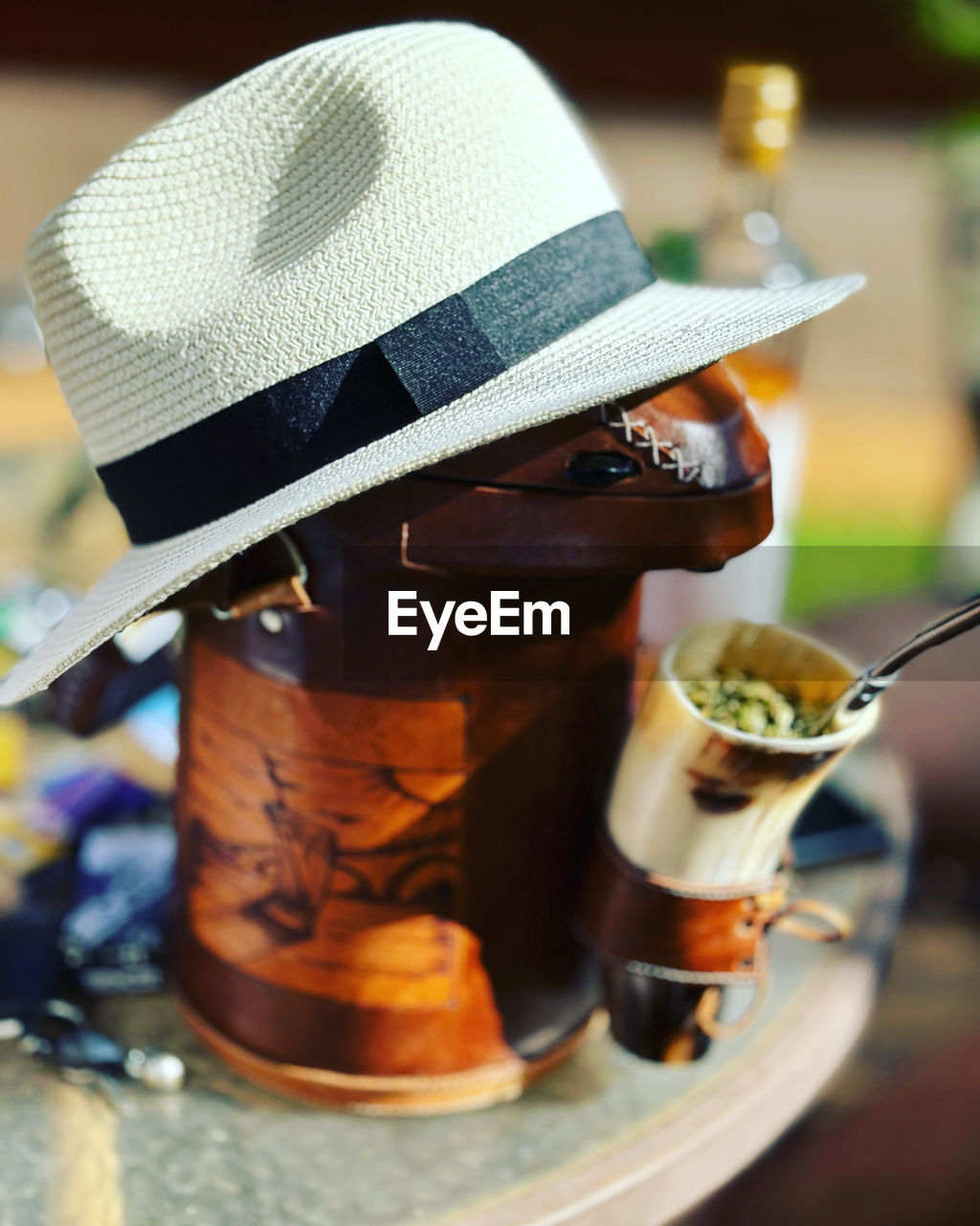 hat, food and drink, fedora, clothing, focus on foreground, one person, drink, food, close-up