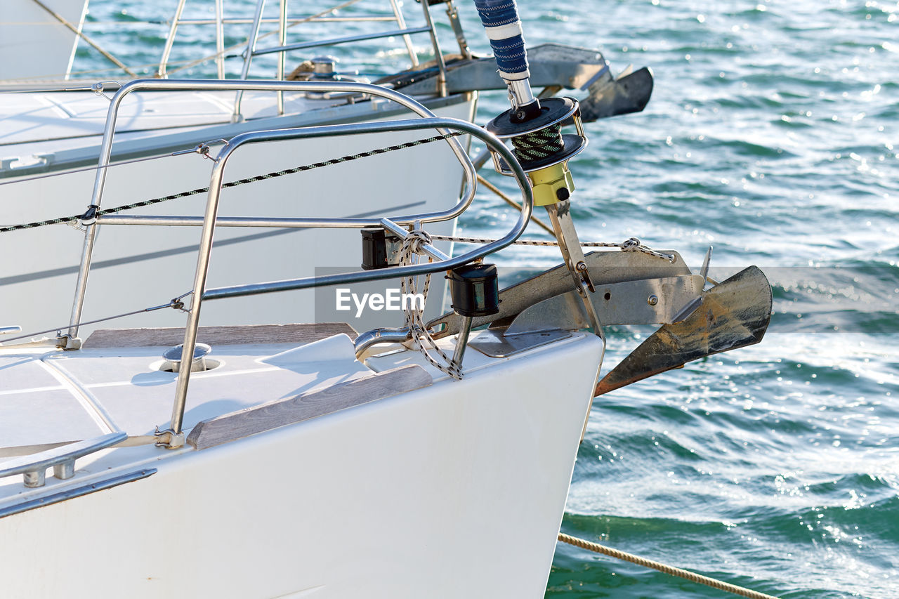 Cropped image of boat sailing on sea