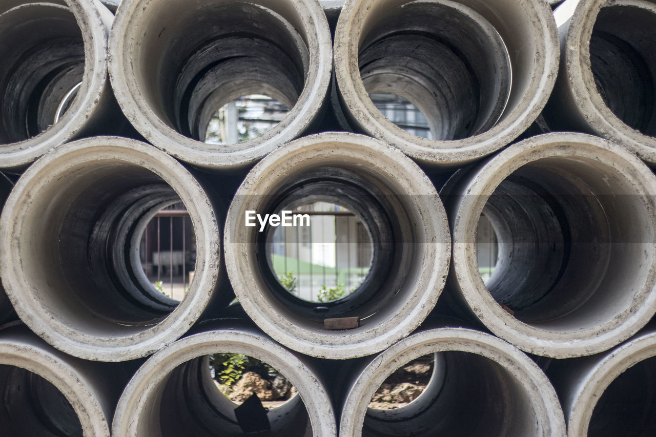 FULL FRAME SHOT OF PIPE SEEN THROUGH CAR