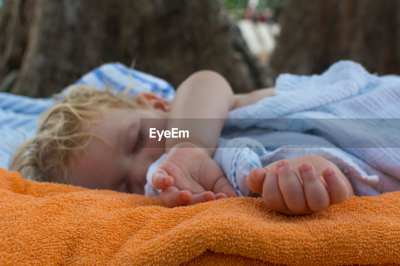 Close-up of baby sleeping outdoors