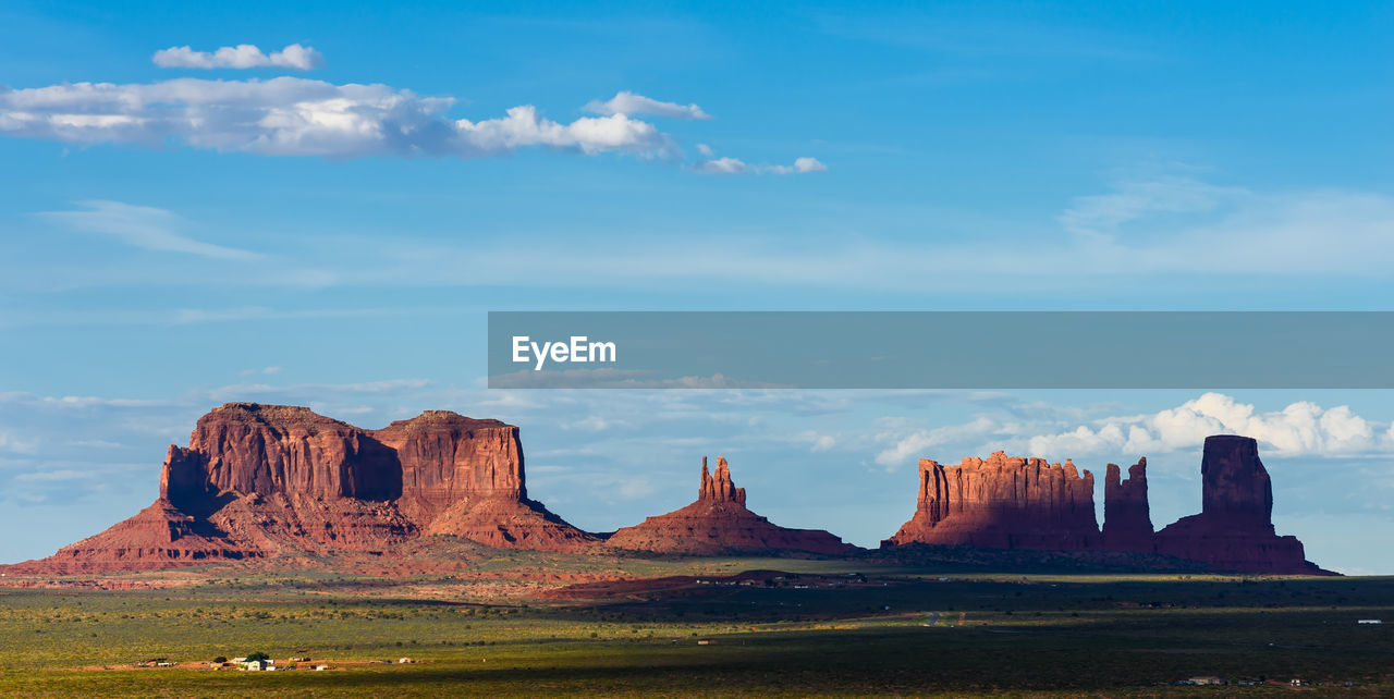 Rock formations on landscape against sky