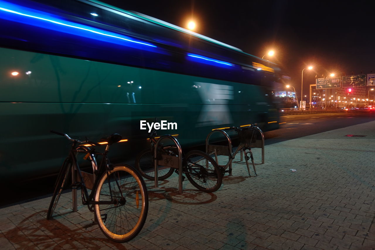 BICYCLES ON STREET AT NIGHT