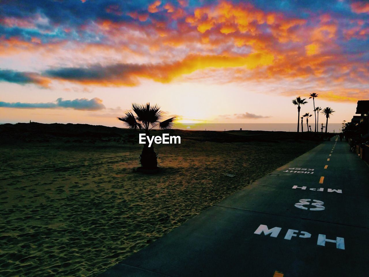 ROAD AGAINST SKY AT SUNSET