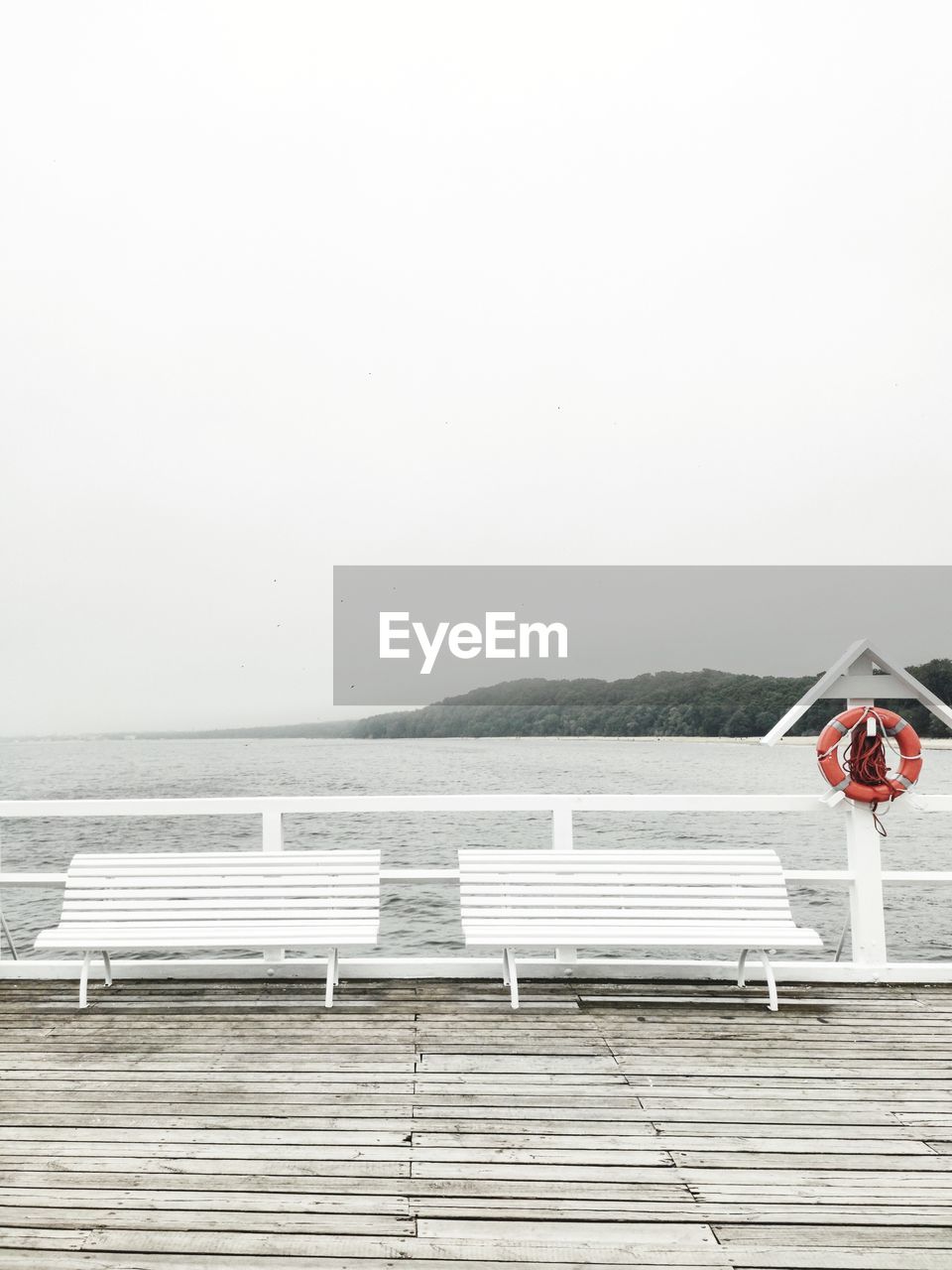 White bench on pier