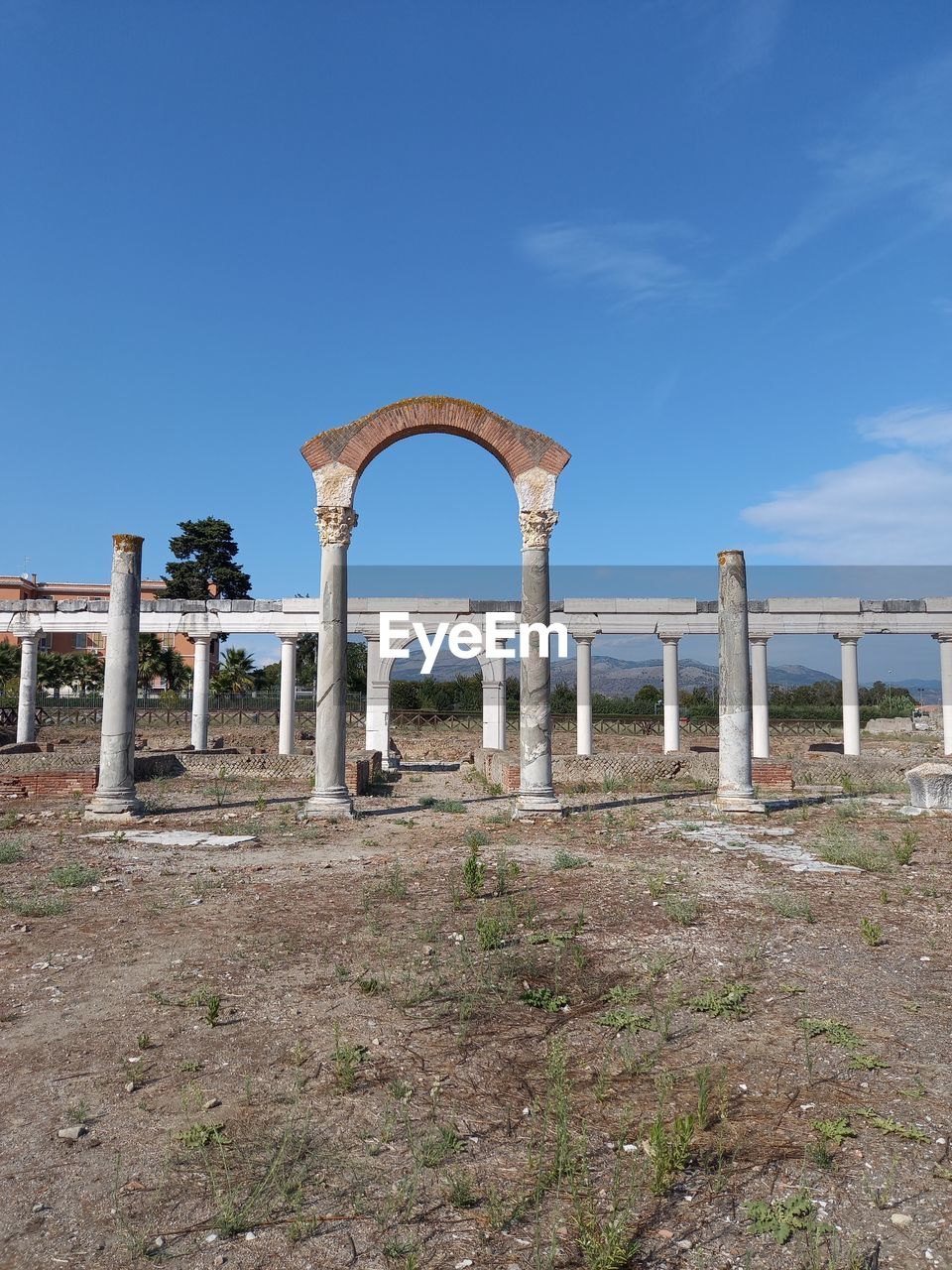 OLD RUIN STRUCTURE AGAINST BLUE SKY