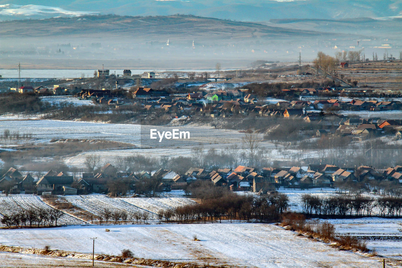 Aerial view of landscape against sky during winter