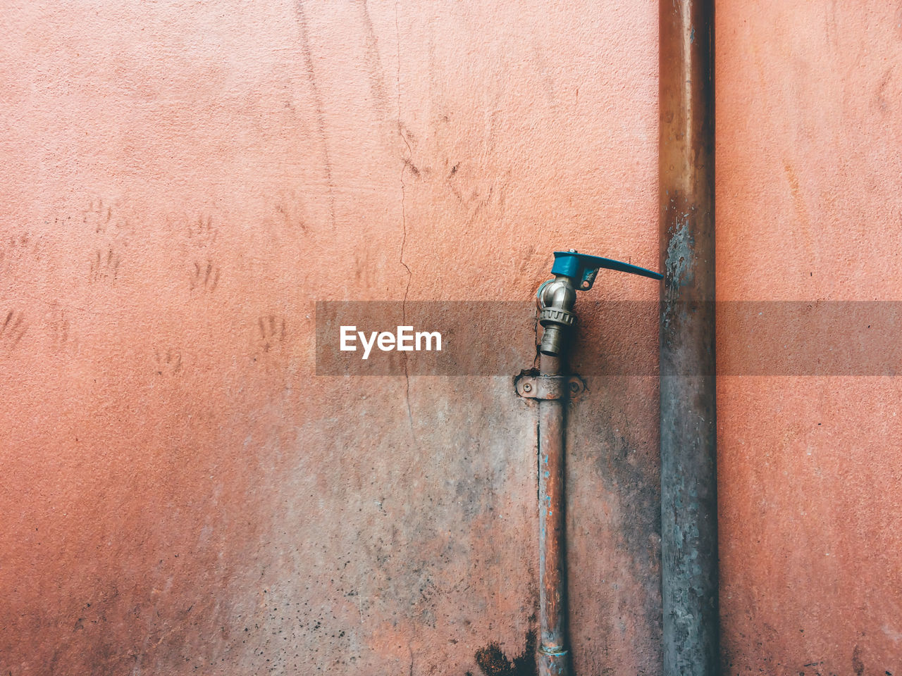 Close-up of pipe against wall