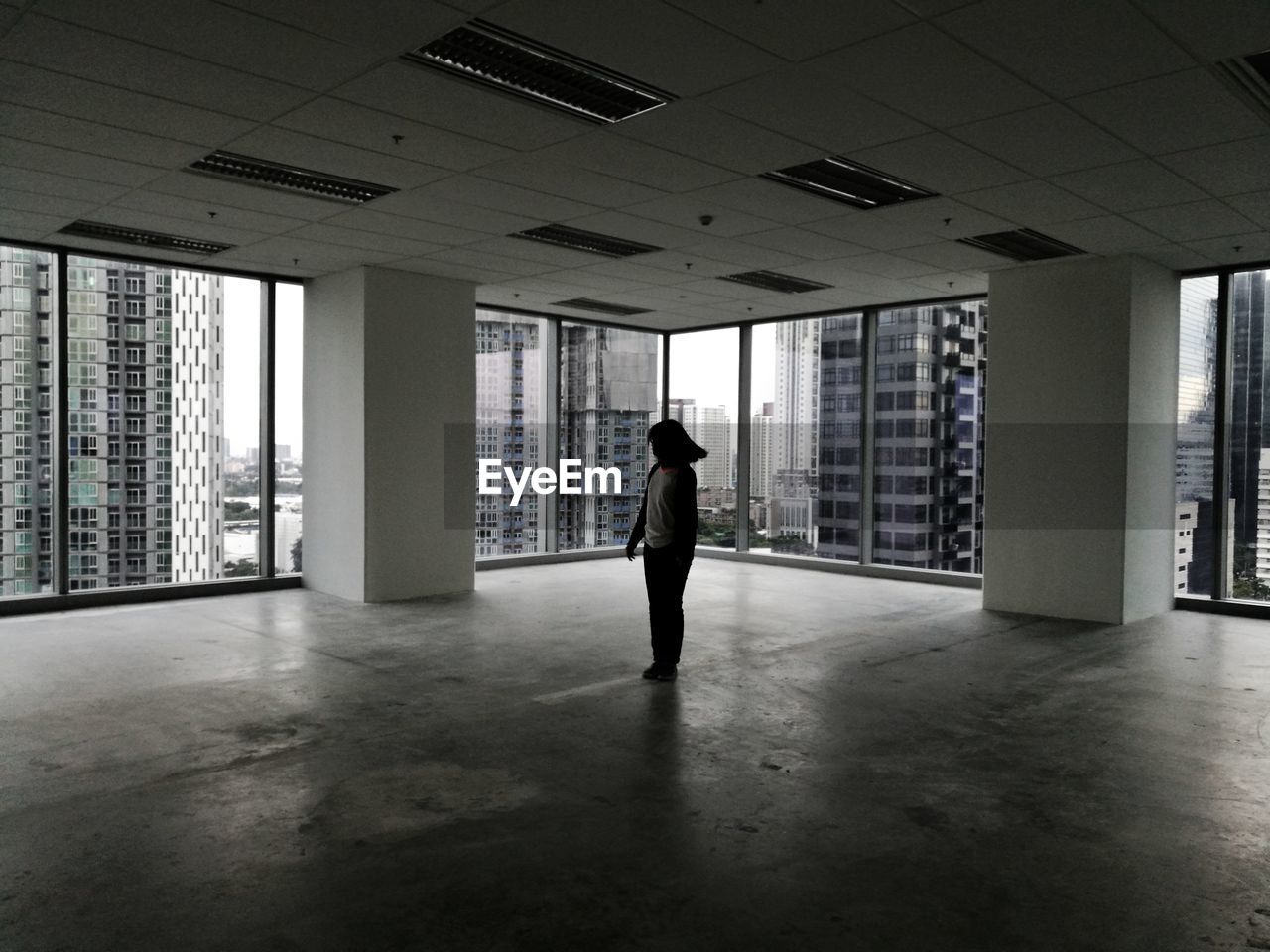 WOMAN WALKING IN CORRIDOR