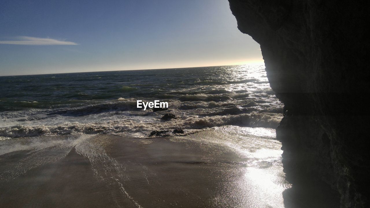 CLOSE-UP OF MAN ON BEACH