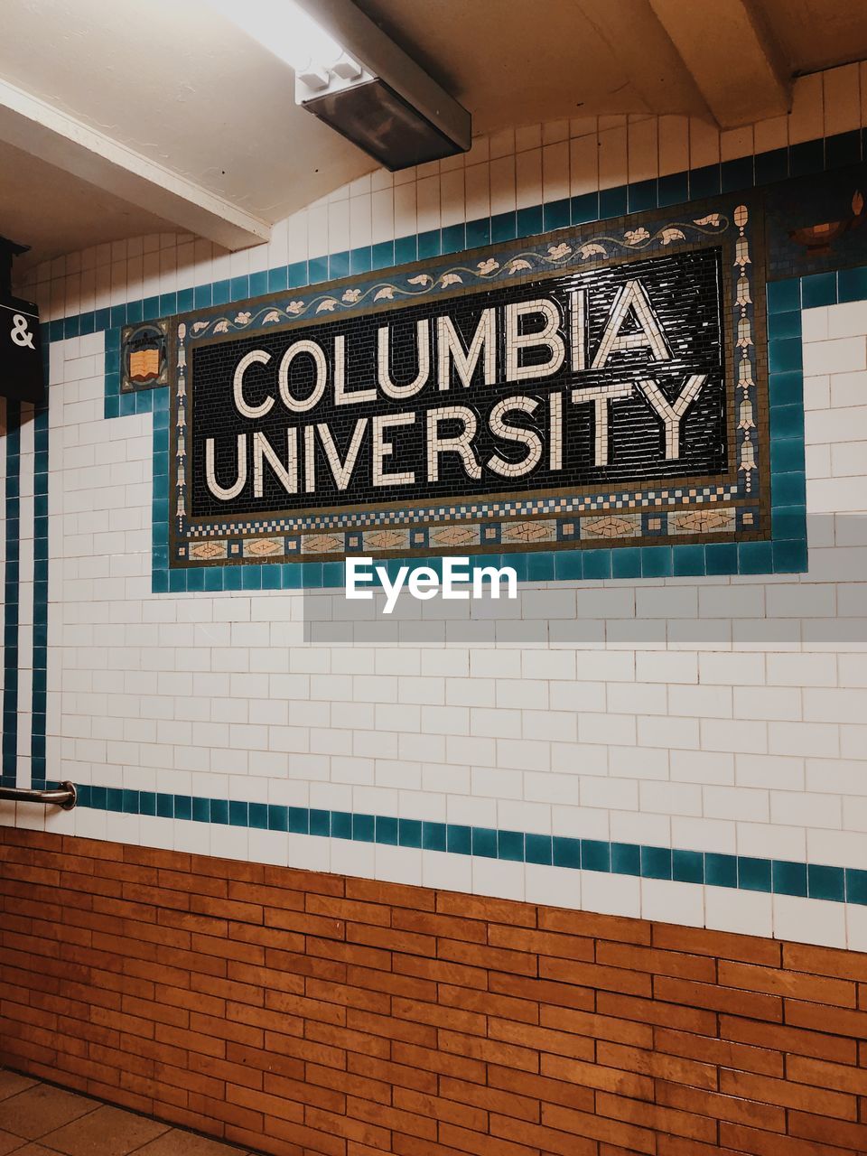 INFORMATION SIGN ON WALL OF SUBWAY STATION