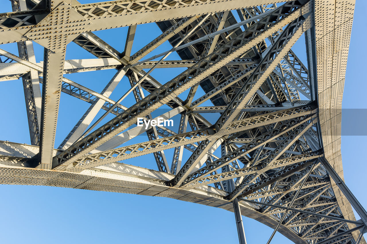 Abstract composition with metallic structure of bridge in porto portugal against clear sky