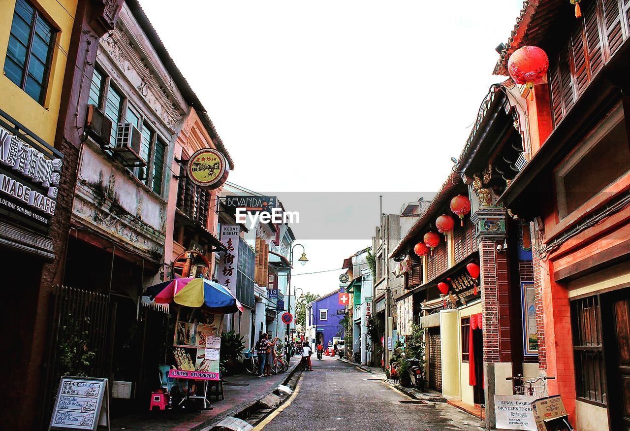 NARROW ROAD LEADING TOWARDS BUILDINGS