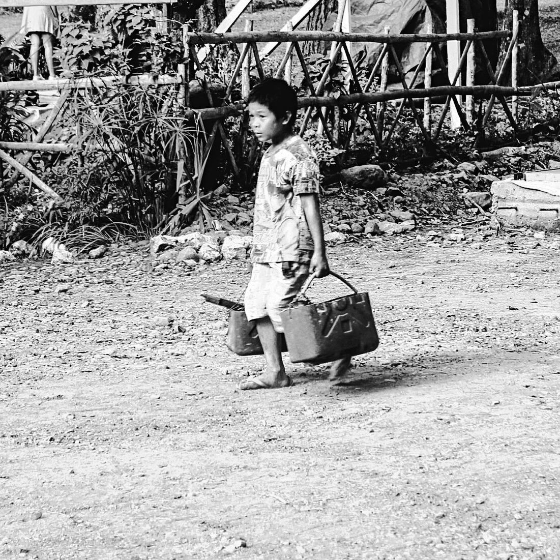 FULL LENGTH OF GIRL PLAYING ON THE GROUND