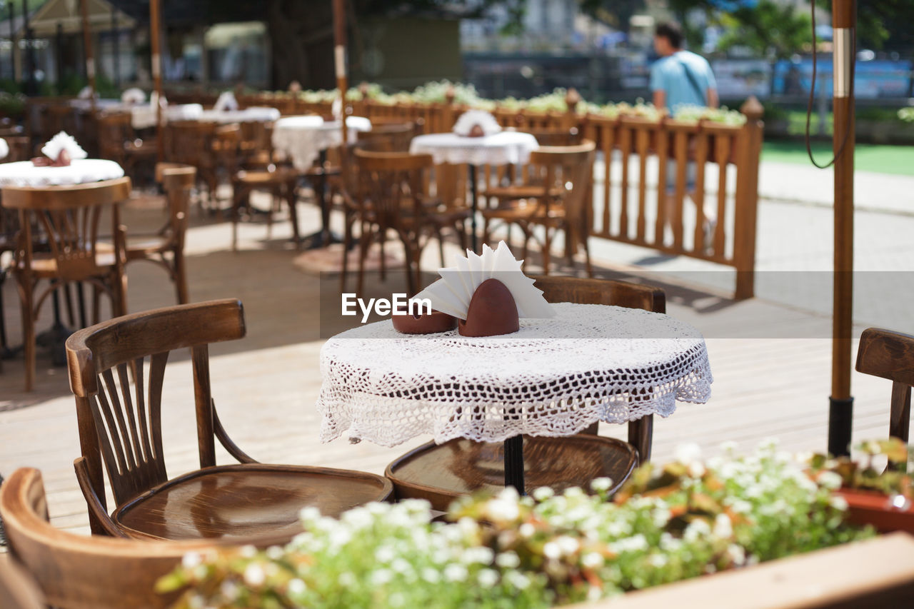 CHAIRS AND TABLE AT CAFE