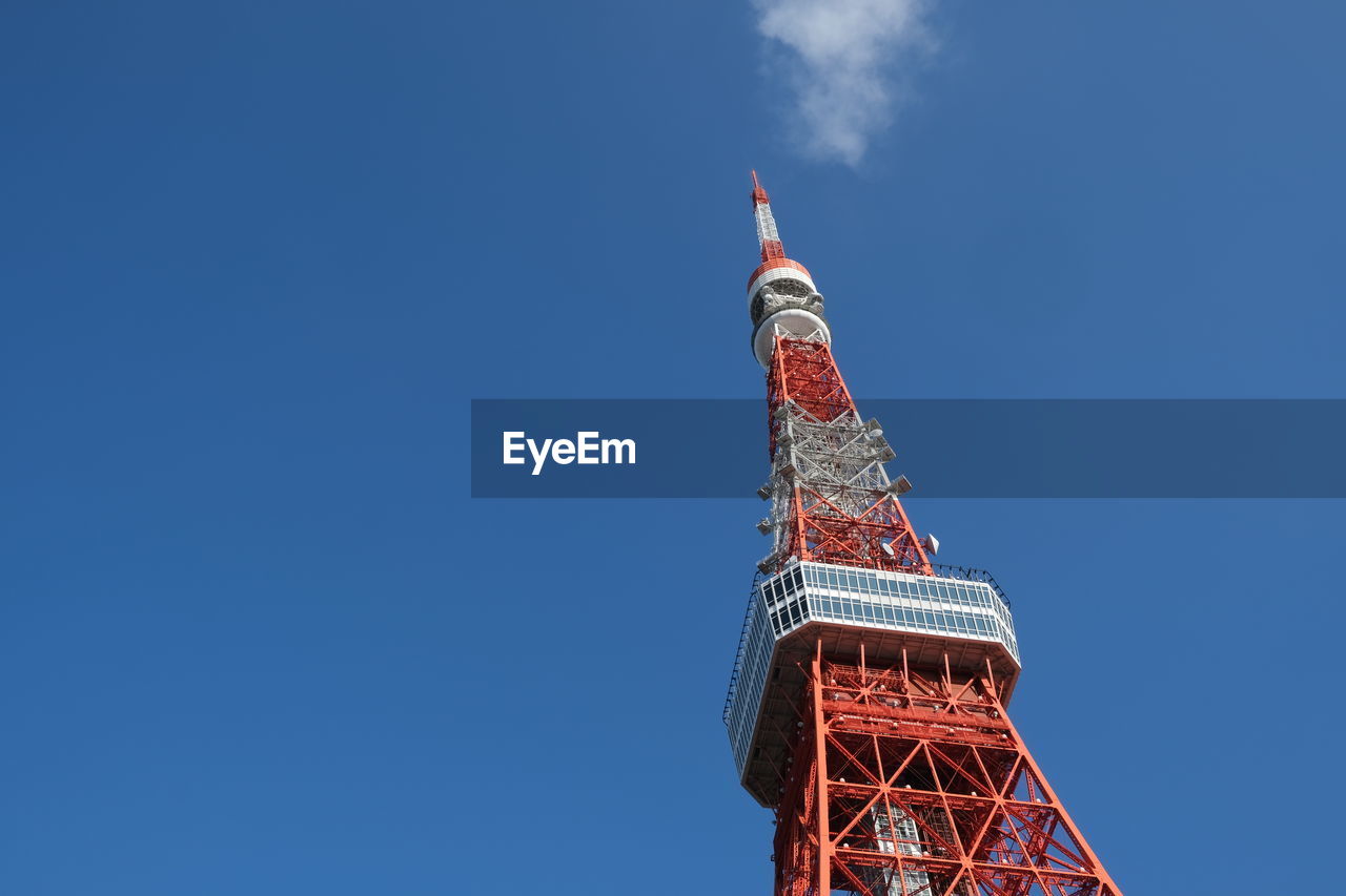 sky, architecture, tower, built structure, blue, nature, travel destinations, no people, travel, copy space, low angle view, landmark, clear sky, outdoors, building exterior, city, communications tower, spire, tourism, skyscraper, red, building, day, sunny