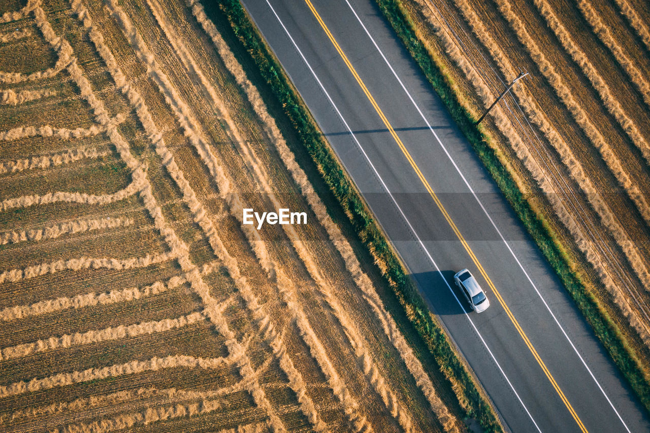 High angle view of car on road amidst field