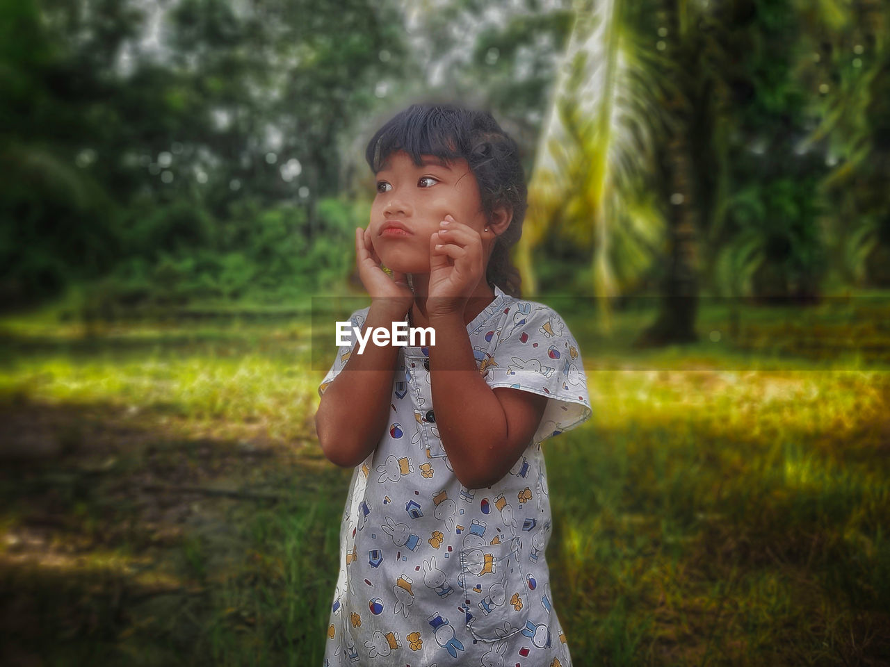 childhood, one person, child, plant, nature, innocence, tree, casual clothing, person, front view, portrait, emotion, cute, female, standing, day, women, outdoors, toddler, land, grass, focus on foreground, waist up, looking, lifestyles, baby, hand, leisure activity, human face