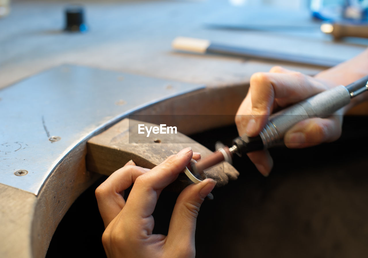 Close-up of jeweler making ring