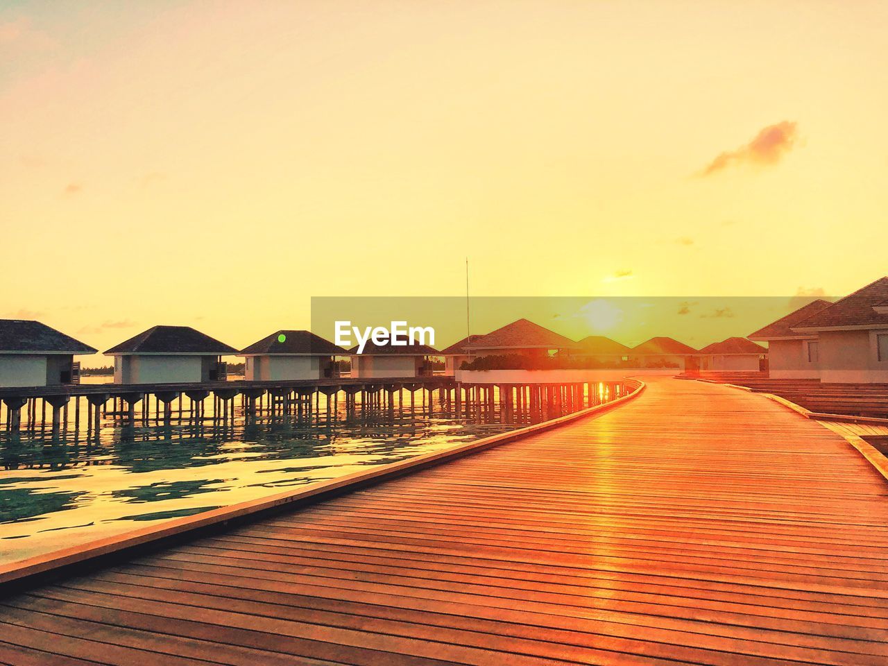 VIEW OF SWIMMING POOL BY SEA AGAINST SKY