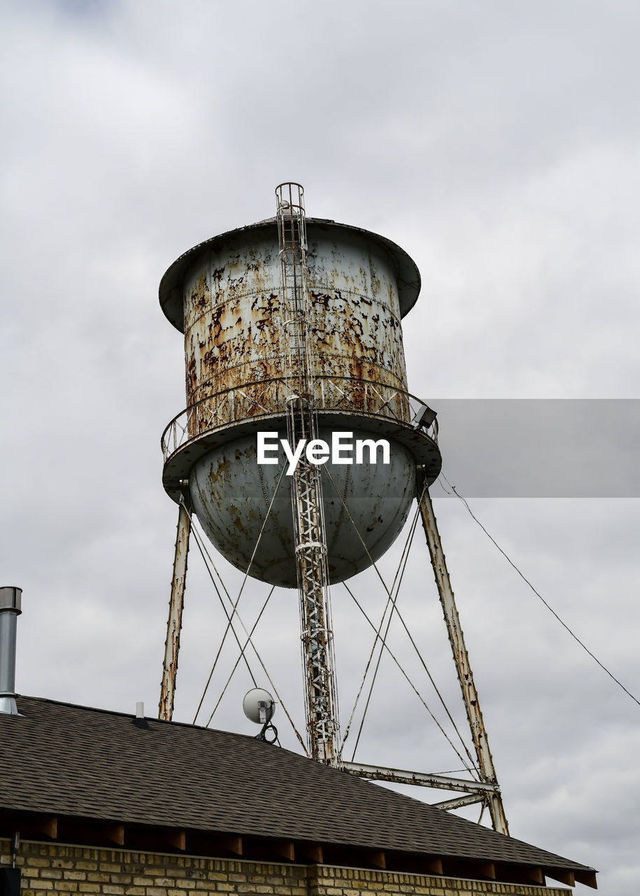 Low angle view of water tower against sky