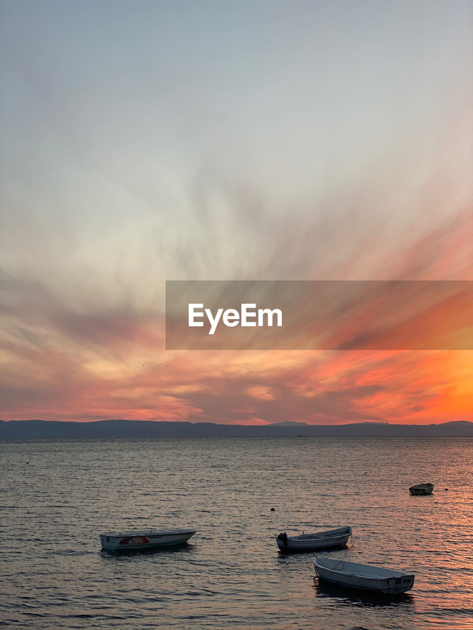 Colorful scenic view of sea against sky during sunset