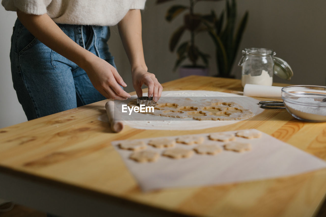 Young woman making christmas cookies