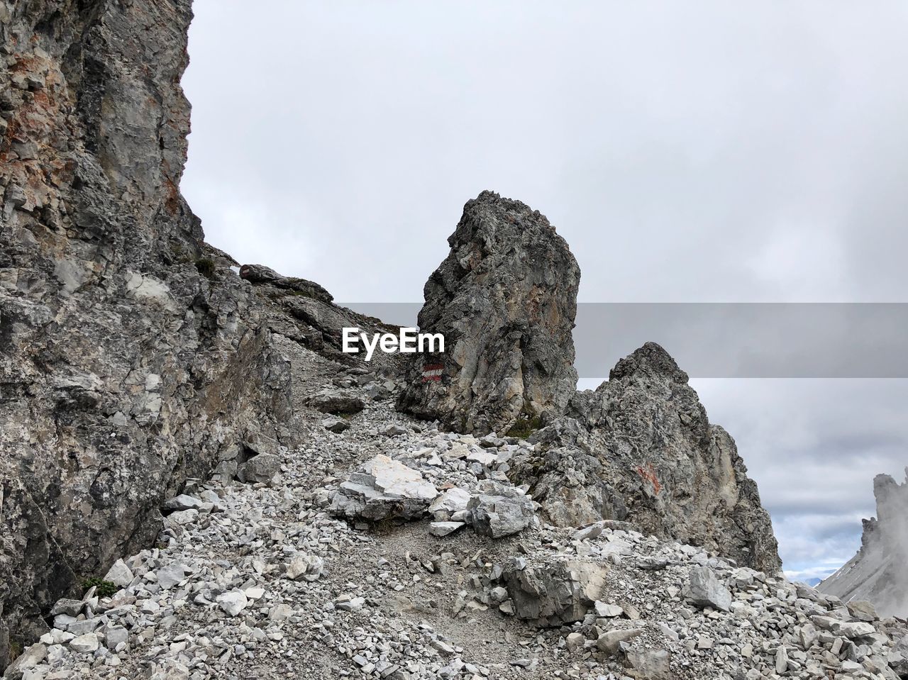 Low angle view of rock formations against sky