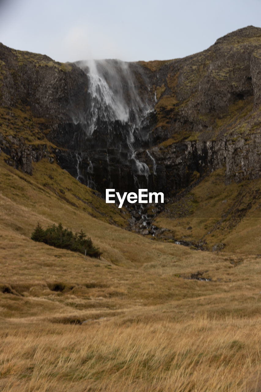 View of a waterfall in strong winds in the snaefelsness peninsula, iceland