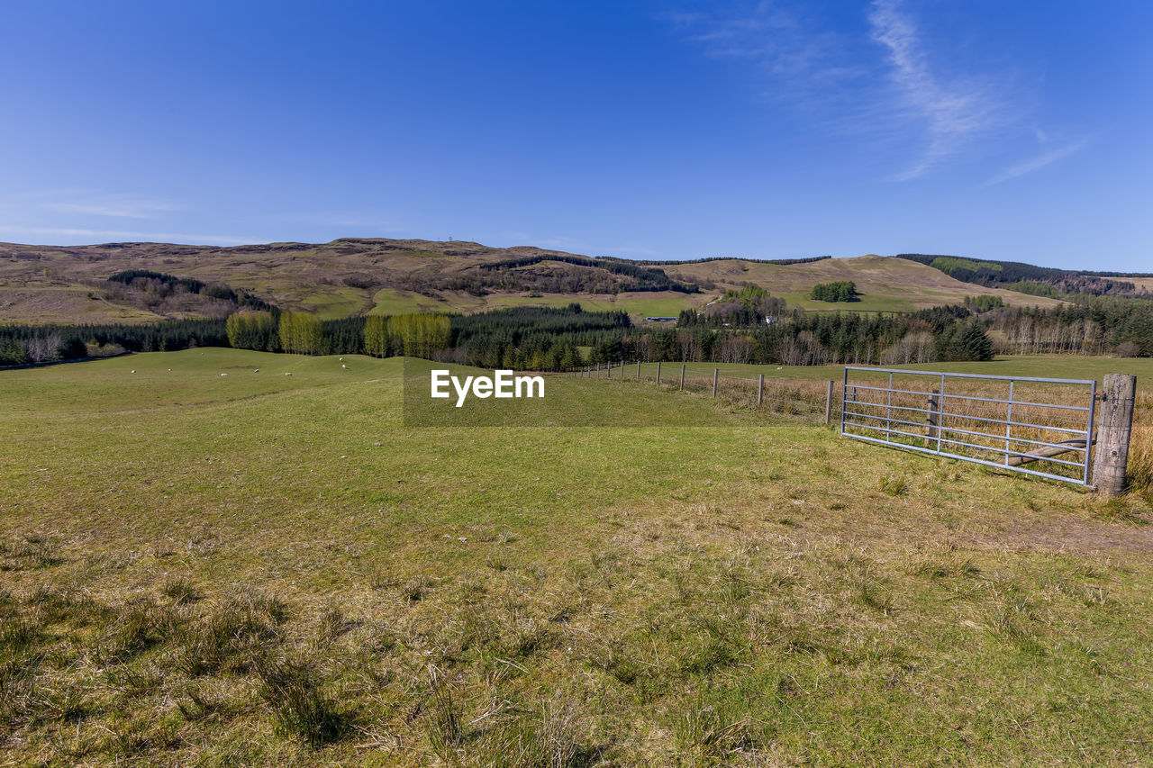 View of green hilly valley and fields located near fort william in scotland