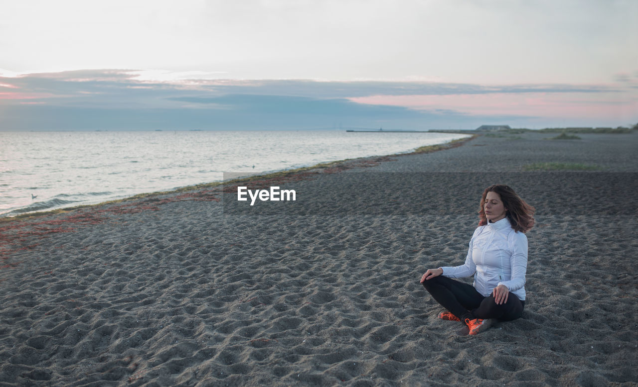 Sunrise mediation on the beach