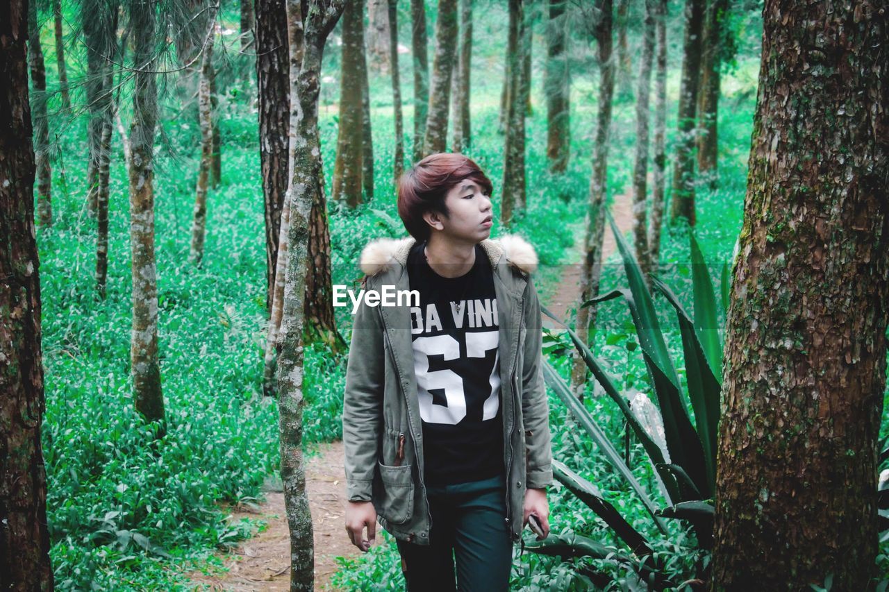 Woman walking in forest