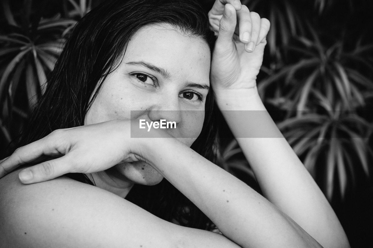 Close-up portrait of smiling young woman