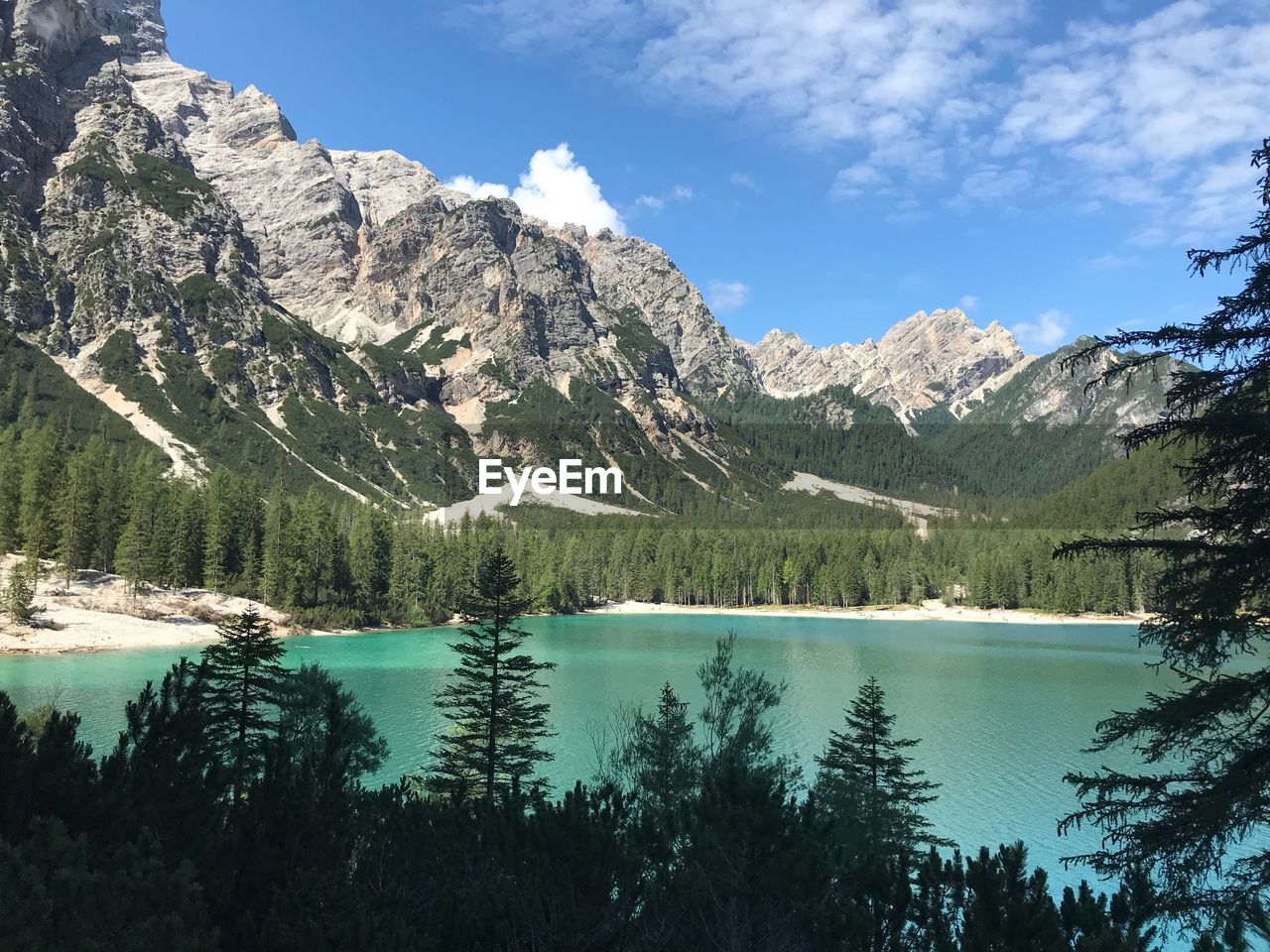 Scenic view of lake and mountains against sky