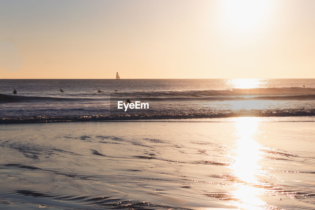 scenic view of sea against clear sky during sunset