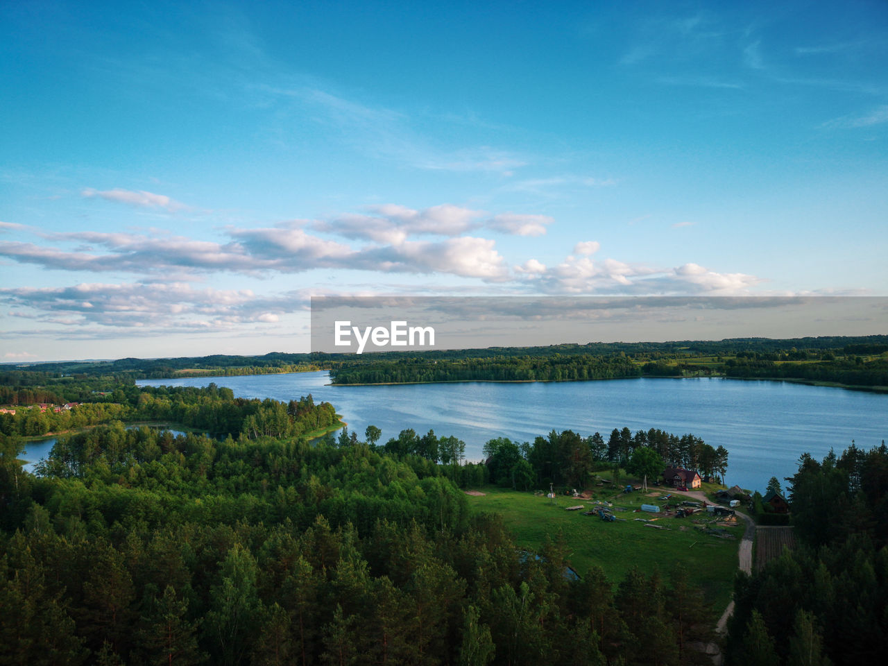 SCENIC VIEW OF LAKE AND TREES AGAINST SKY