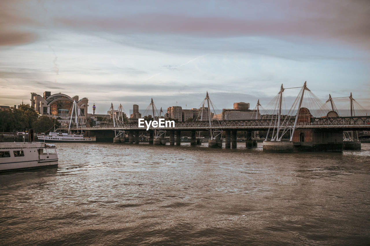 View of bridge over river in city