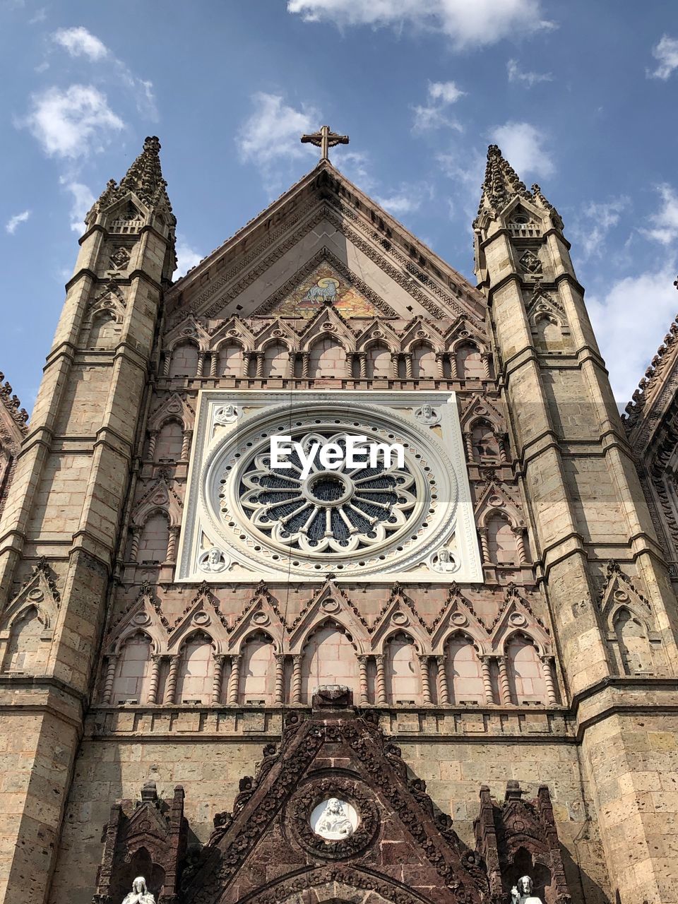 Low angle view of clock tower against sky