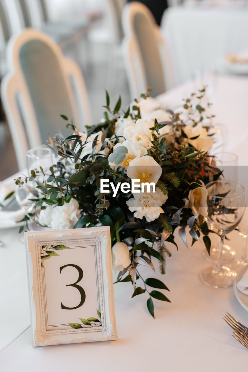 CLOSE-UP OF POTTED PLANTS ON TABLE