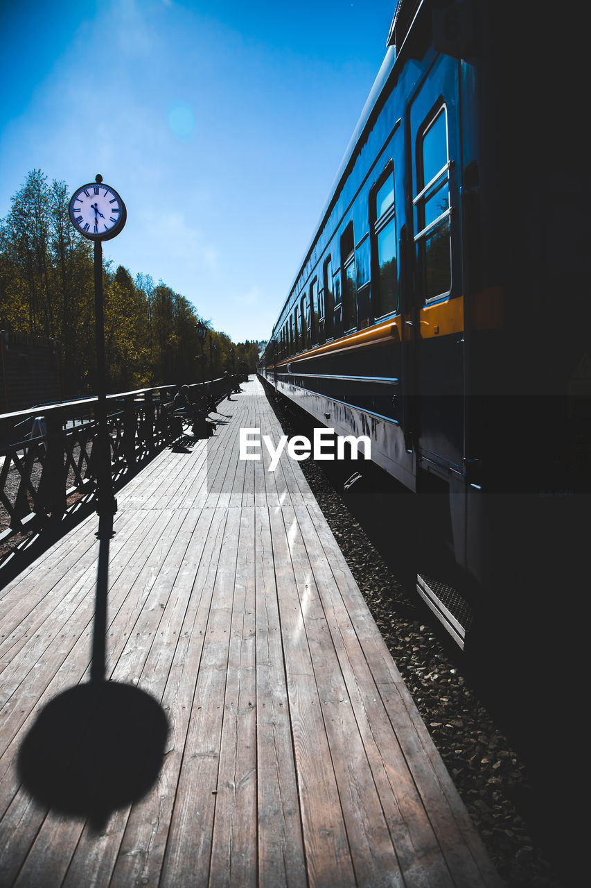 VIEW OF RAILROAD TRACKS AGAINST SKY