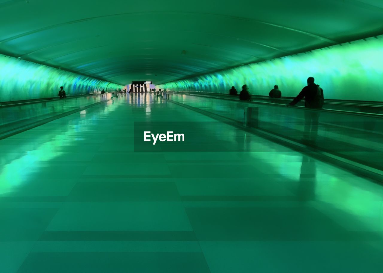 Illuminated green subway station