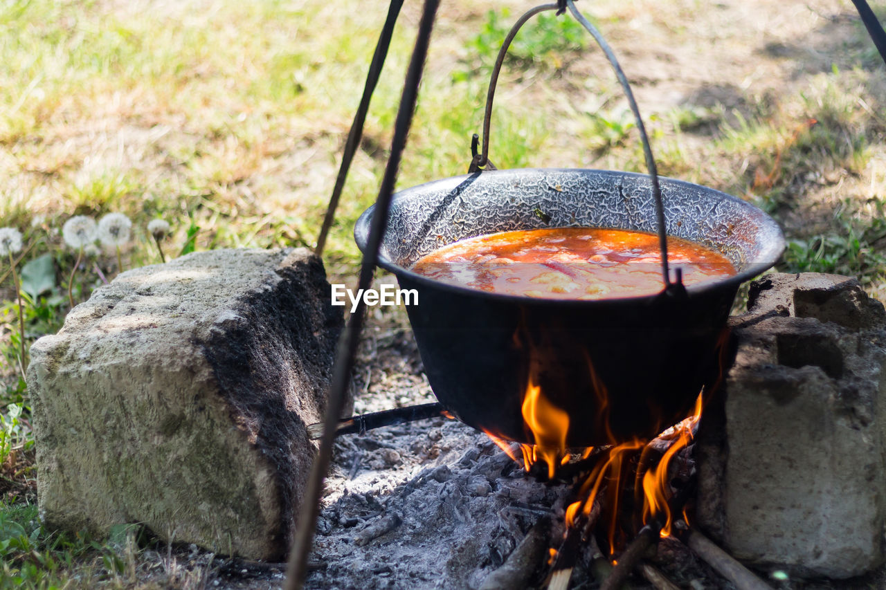 HIGH ANGLE VIEW OF FIRE ON TABLE