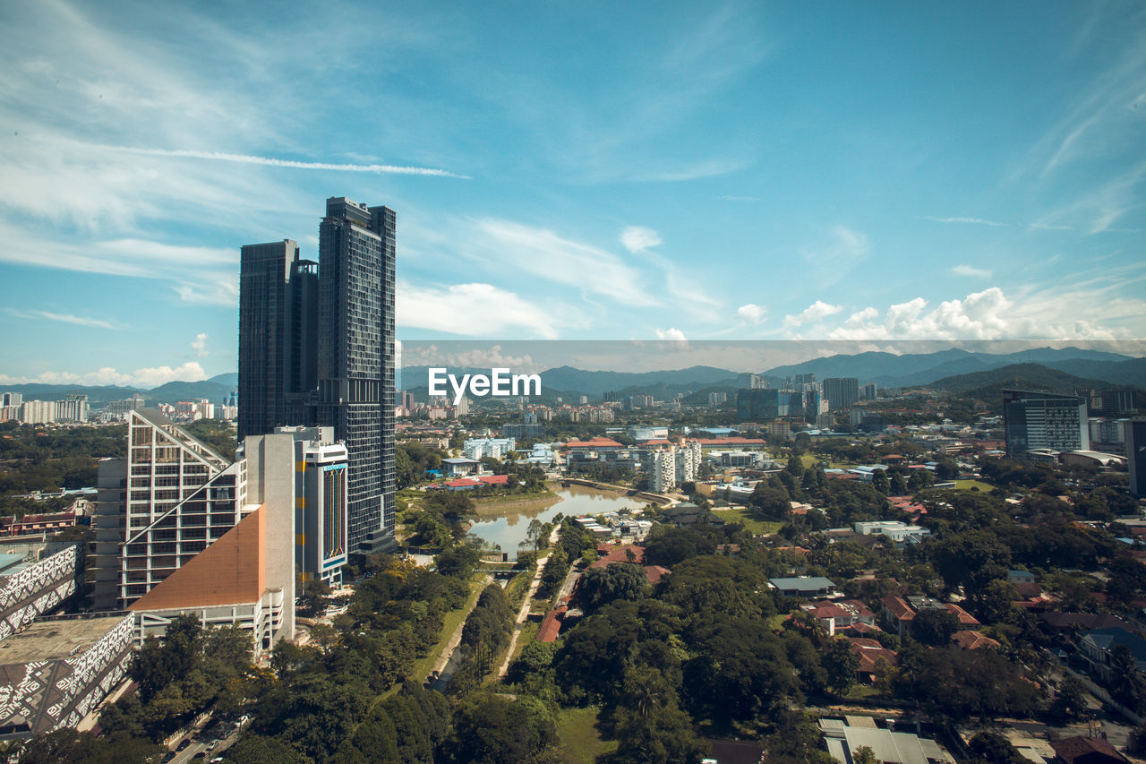 High angle view of modern buildings against sky